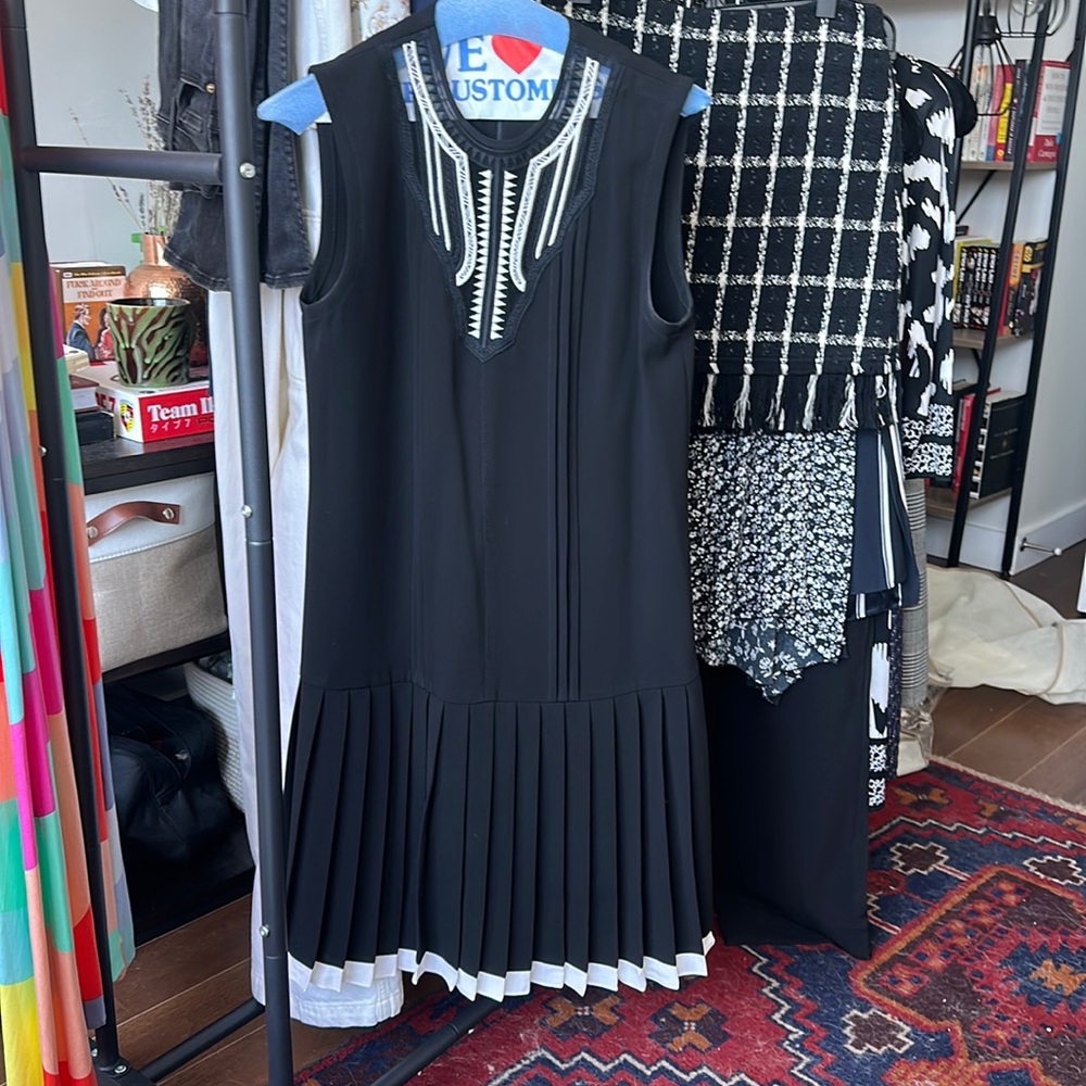 Yigal Azrouel black mini dress with pleated skirt, size 6